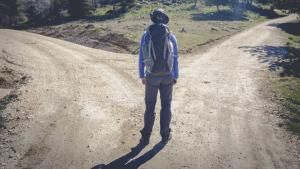 Man hiking choosing which path